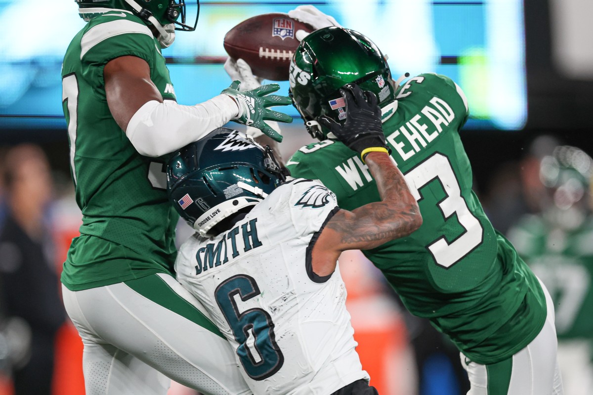 Oct 15, 2023; East Rutherford, New Jersey, USA; New York Jets safety Jordan Whitehead (3) breaks up a pass intended for Philadelphia Eagles wide receiver DeVonta Smith (6) in front of cornerback Bryce Hall (37) during the second half at MetLife Stadium.